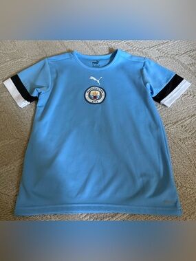 Like New! PUMA Manchester City Kids Short-Sleeve Practice Jersey. Size Medium.